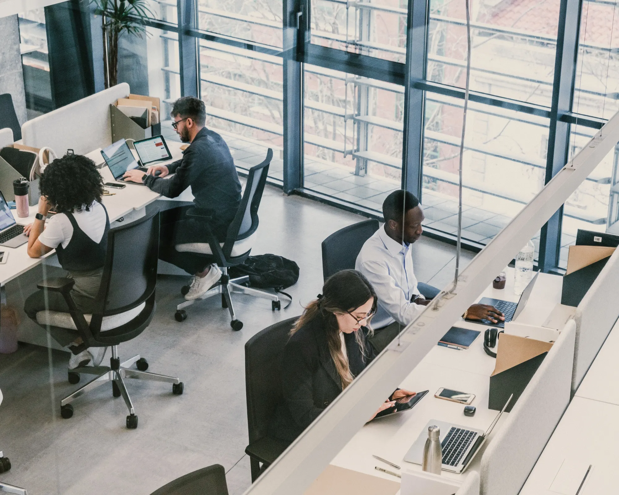 Diverse international team collaborating in a modern office at IberianTax